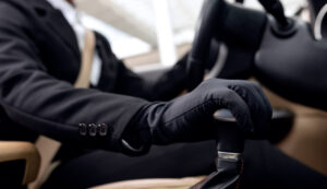 eagles chauffeurs driver shifting gears, picking up client, fast and reliable chauffeurs, Eagles Chauffeurs