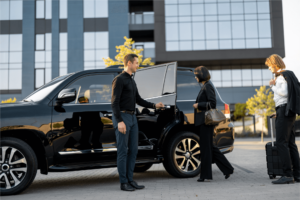Chauffeur greets passengers for event transport service, exemplifying Eagles Chauffeurs' commitment to professional chauffeur services, navigate london with ease, travel in style